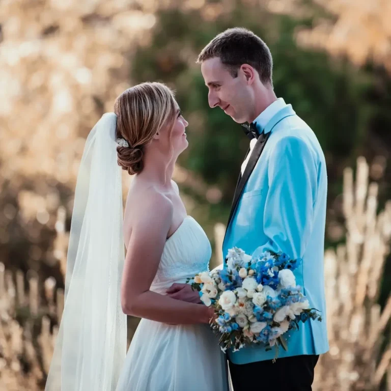 Bride and groom gazing at each other lovingly in an outdoor wedding setting in Wellington