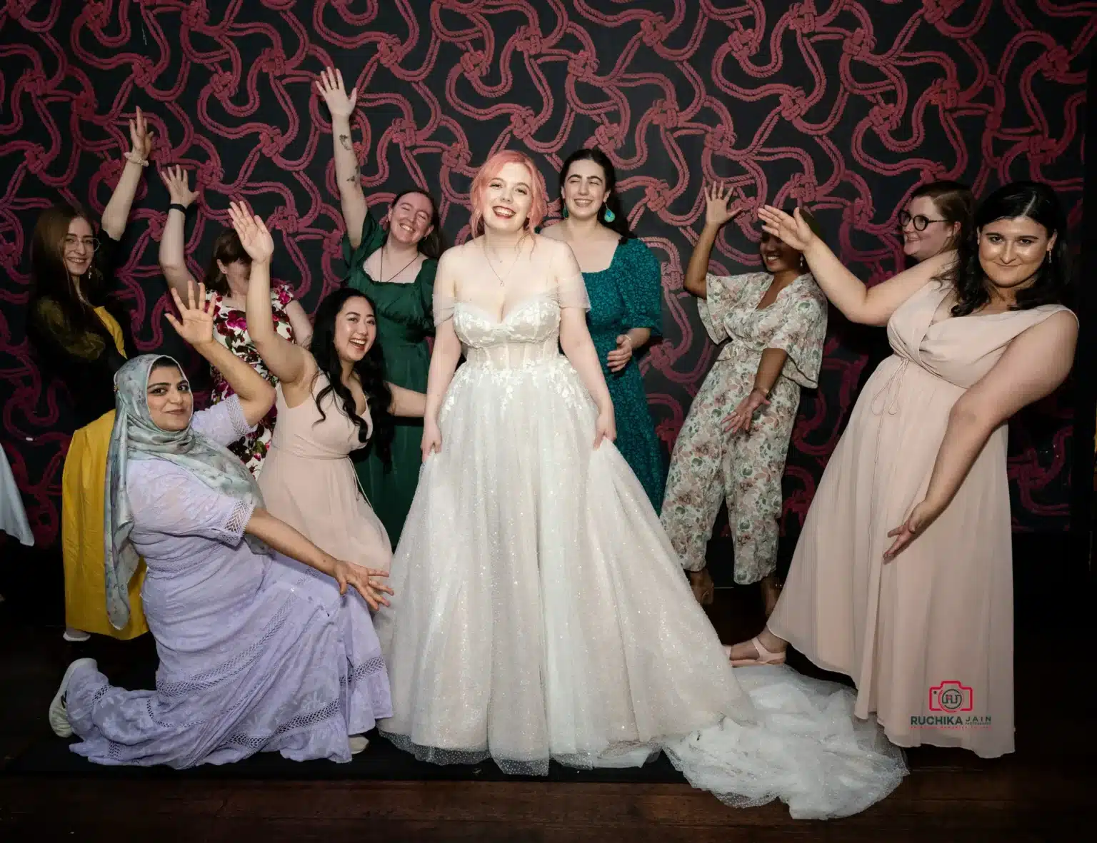 Bride and bridesmaids posing playfully, celebrating together at a Wellington wedding