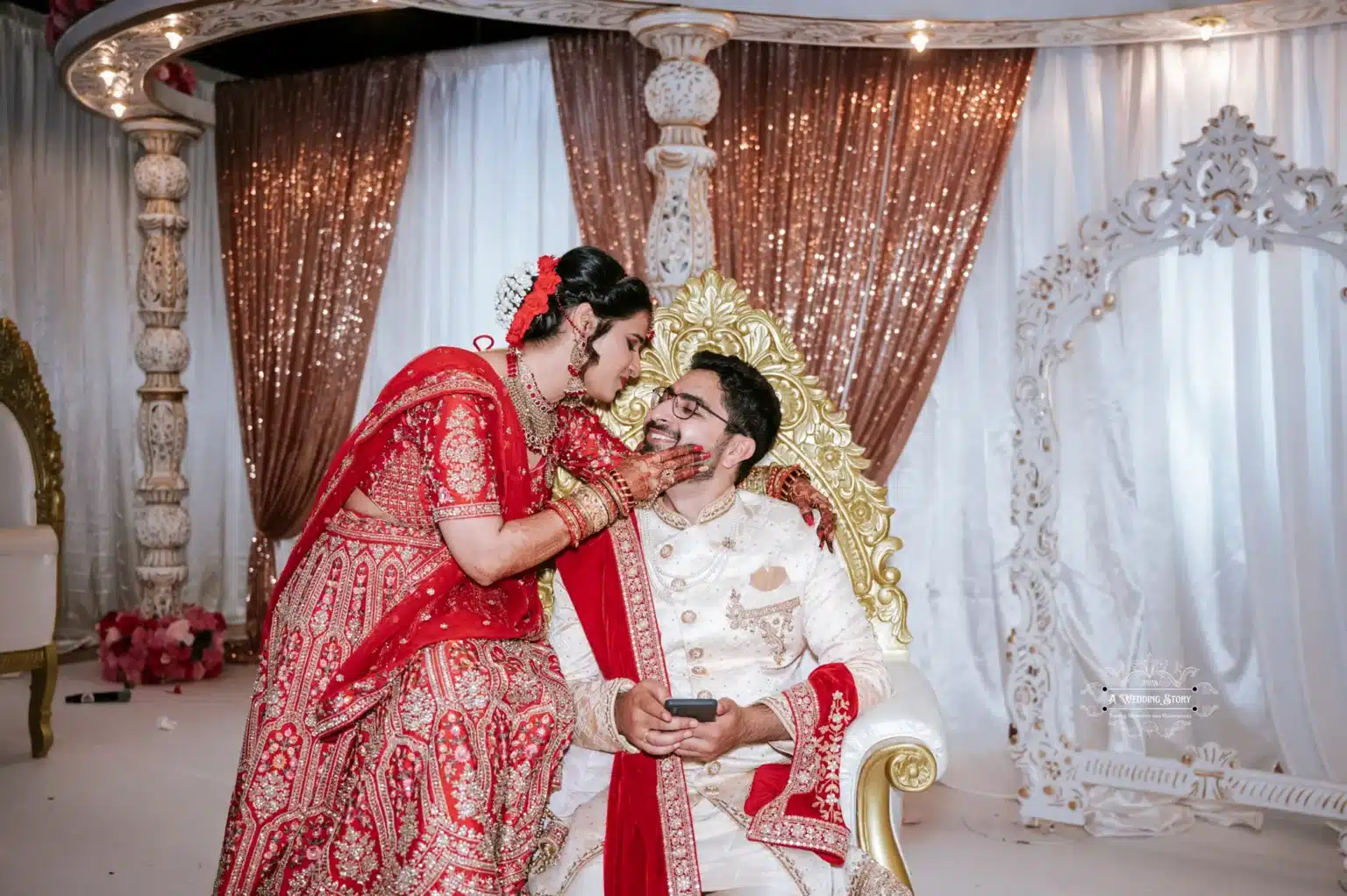 Indian bride leaning towards groom in a loving gesture, captured during their wedding ceremony in Wellington by Wedding Photography.