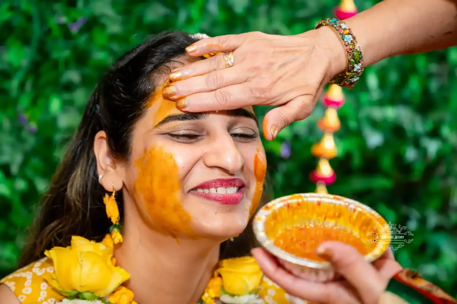 Bride receiving haldi on her forehead as part of the traditional Haldi ceremony in Wellington.