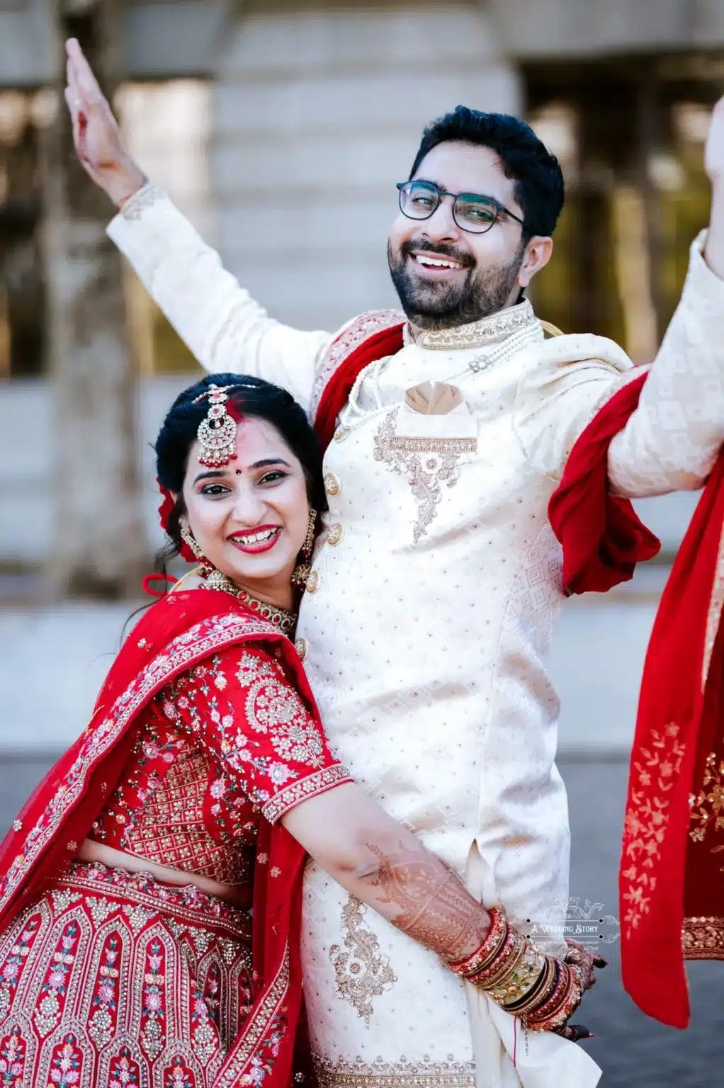 Bride and groom sharing a joyful, celebratory pose during their wedding in Wellington, New Zealand.