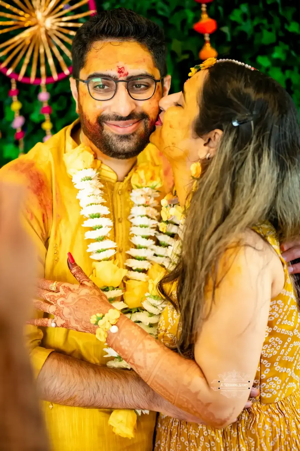 Bride kisses groom on the cheek during Haldi ceremony, captured by Wedding Photography in Wellington, New Zealand