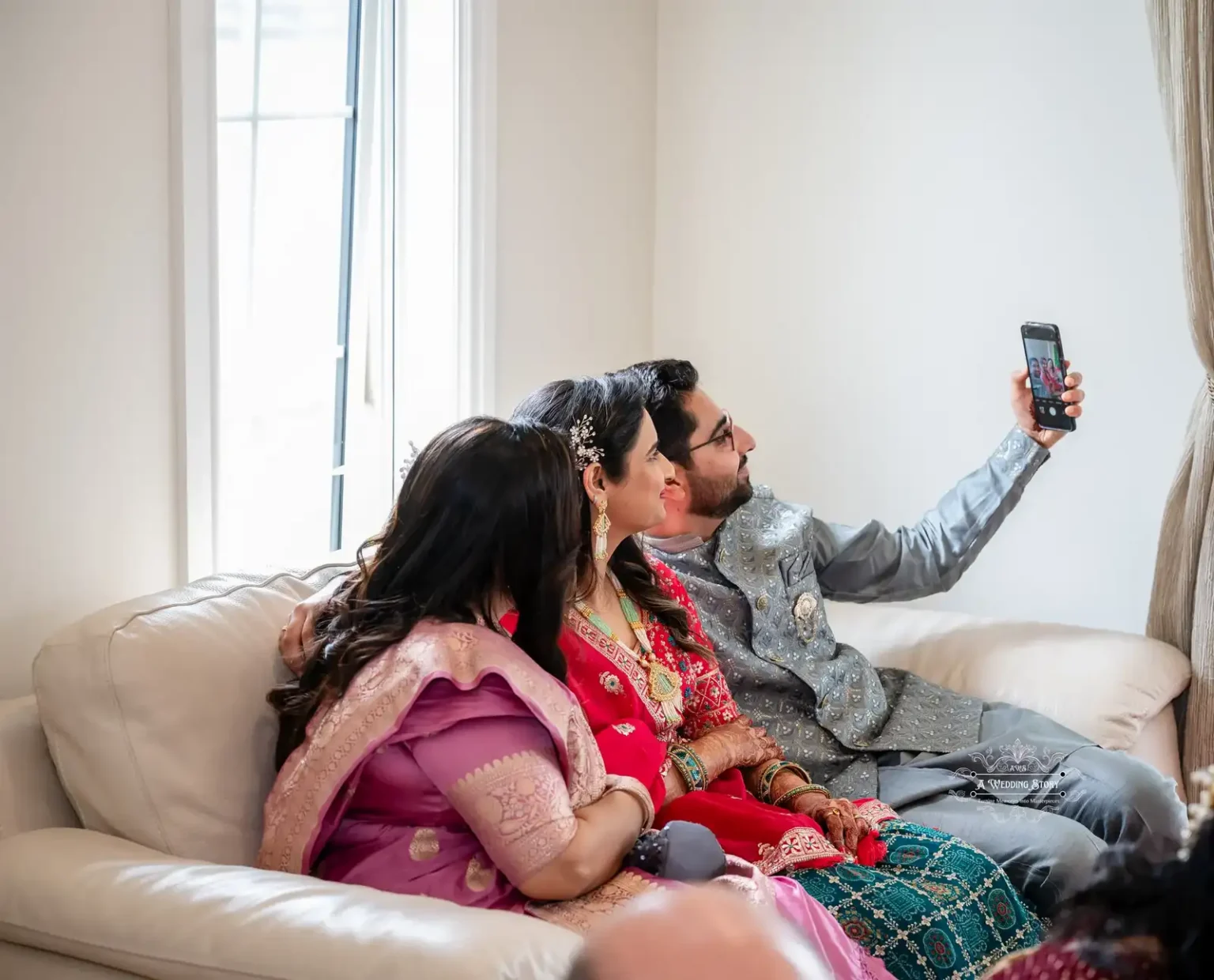 Couple taking a selfie with a family member during a wedding celebration, captured by Wedding Photography in Wellington