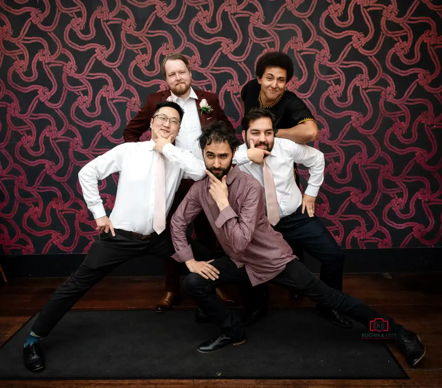 Groomsmen striking playful poses for a memorable group photo at a Wellington wedding