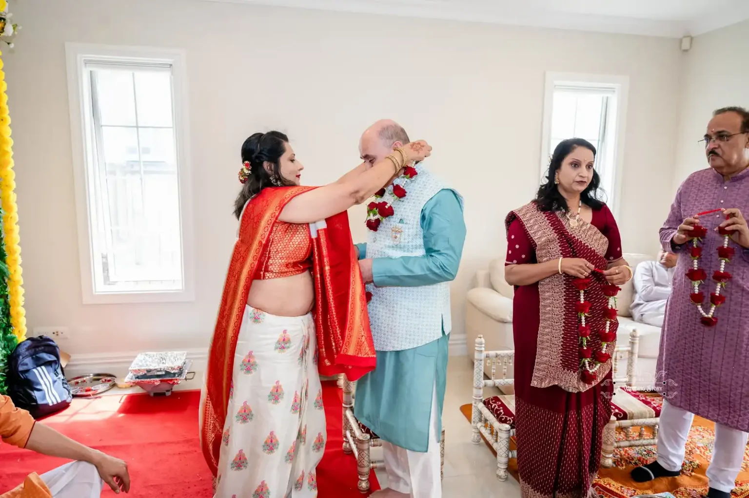 Couple exchanging garlands during a wedding ceremony in Wellington, captured by Wedding Photography