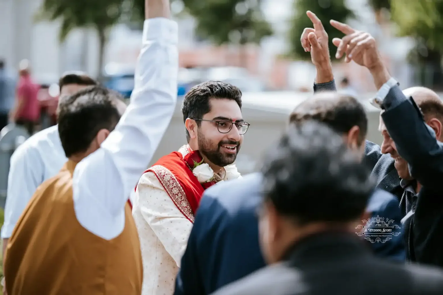 Groom celebrating with family and friends during a wedding procession, captured by Wedding Photography in Wellington