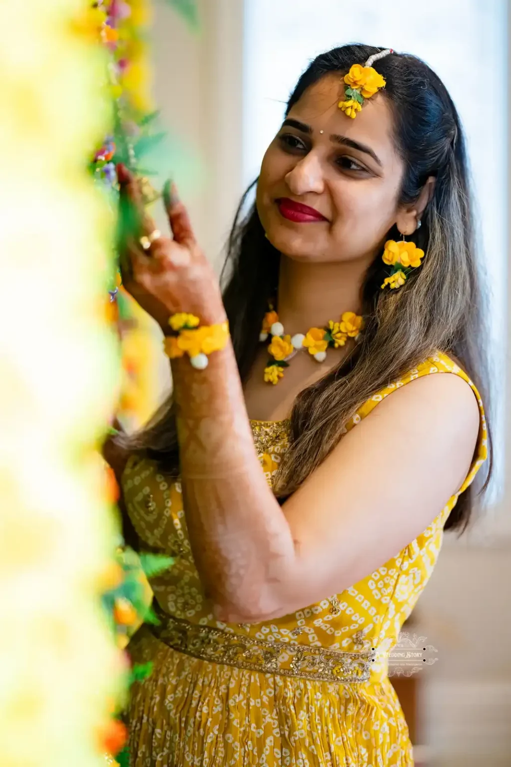 Bride in yellow floral jewelry during Haldi ceremony, captured by Wedding Photography in Wellington, New Zealand