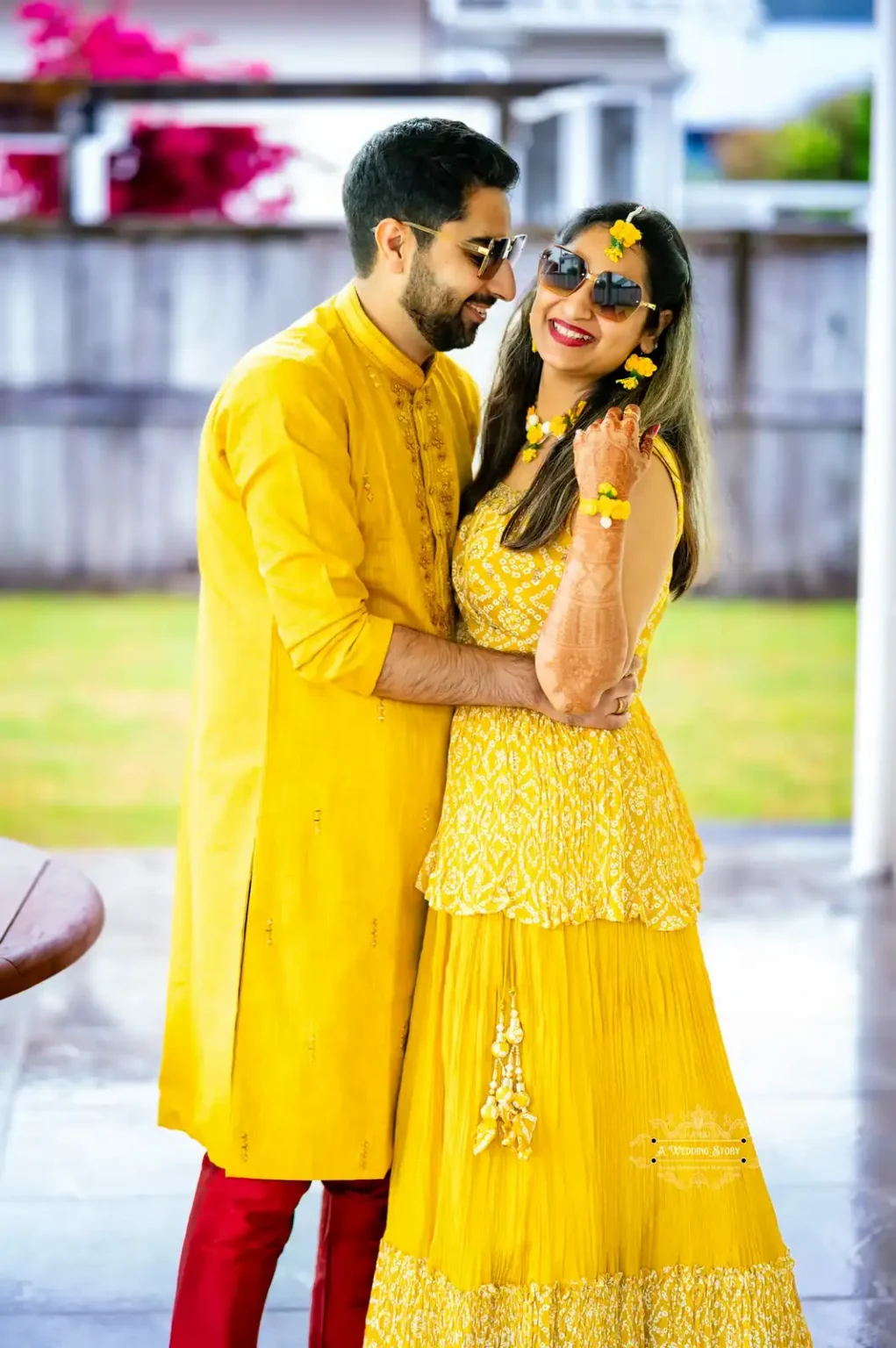 Bride and groom in yellow attire sharing a joyful moment during Haldi ceremony, captured by Wedding Photography in Wellington, New Zealand