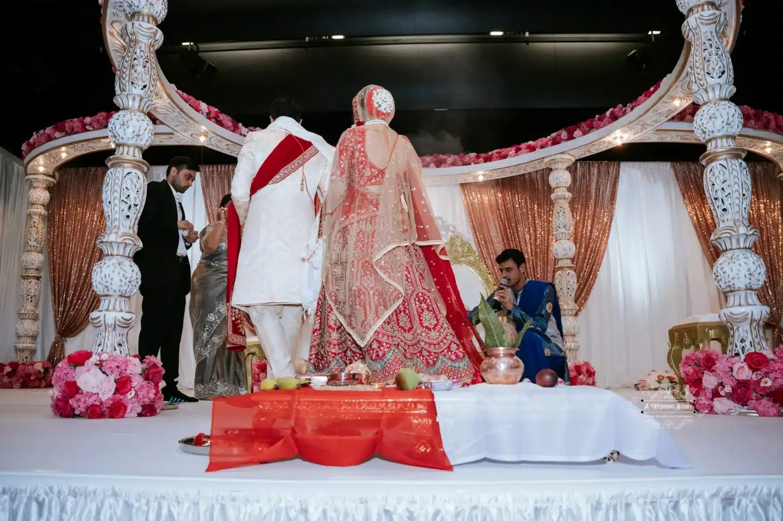 Indian bride and groom standing together during their traditional wedding ceremony in Wellington, New Zealand, captured by Wedding Photography.