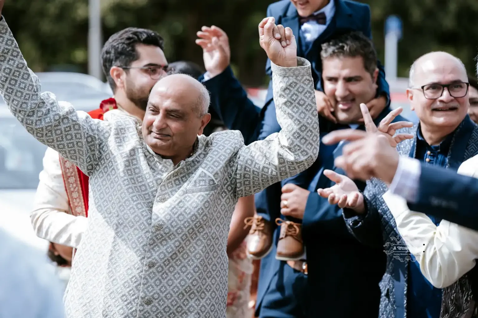 Elder family member dancing joyfully at a wedding celebration, captured by Wedding Photography in Wellington