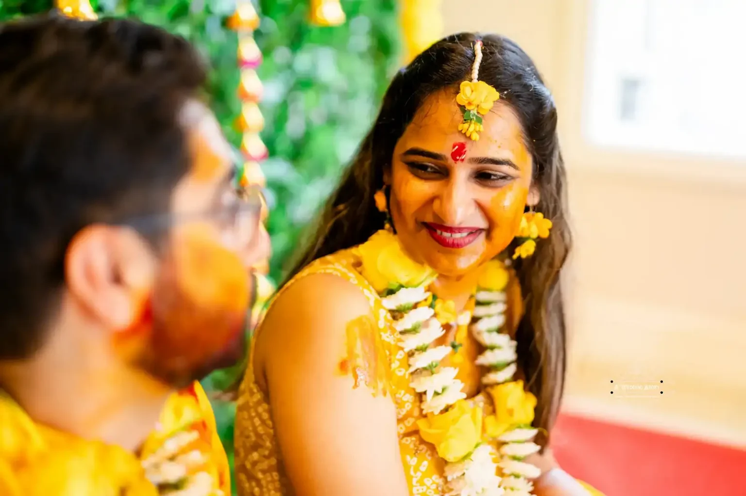 Bride smiling at groom during Haldi ceremony, captured by Wedding Photography in Wellington, New Zealand