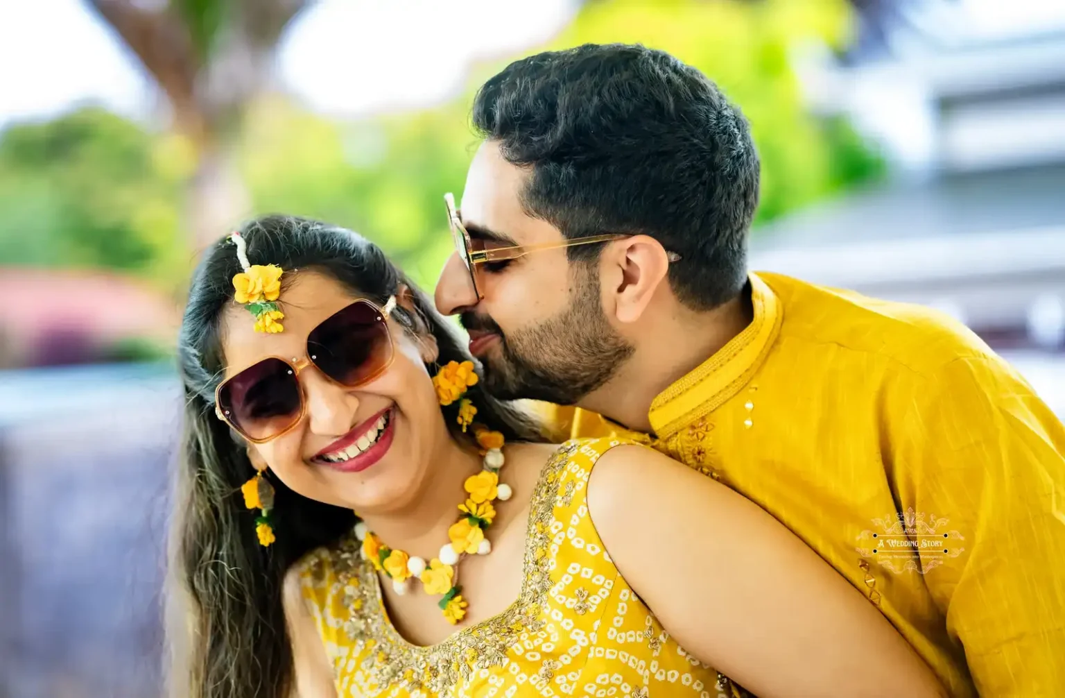 Bride and groom wearing sunglasses and sharing a joyful moment during Haldi ceremony, captured by Wedding Photography in Wellington, New Zealand