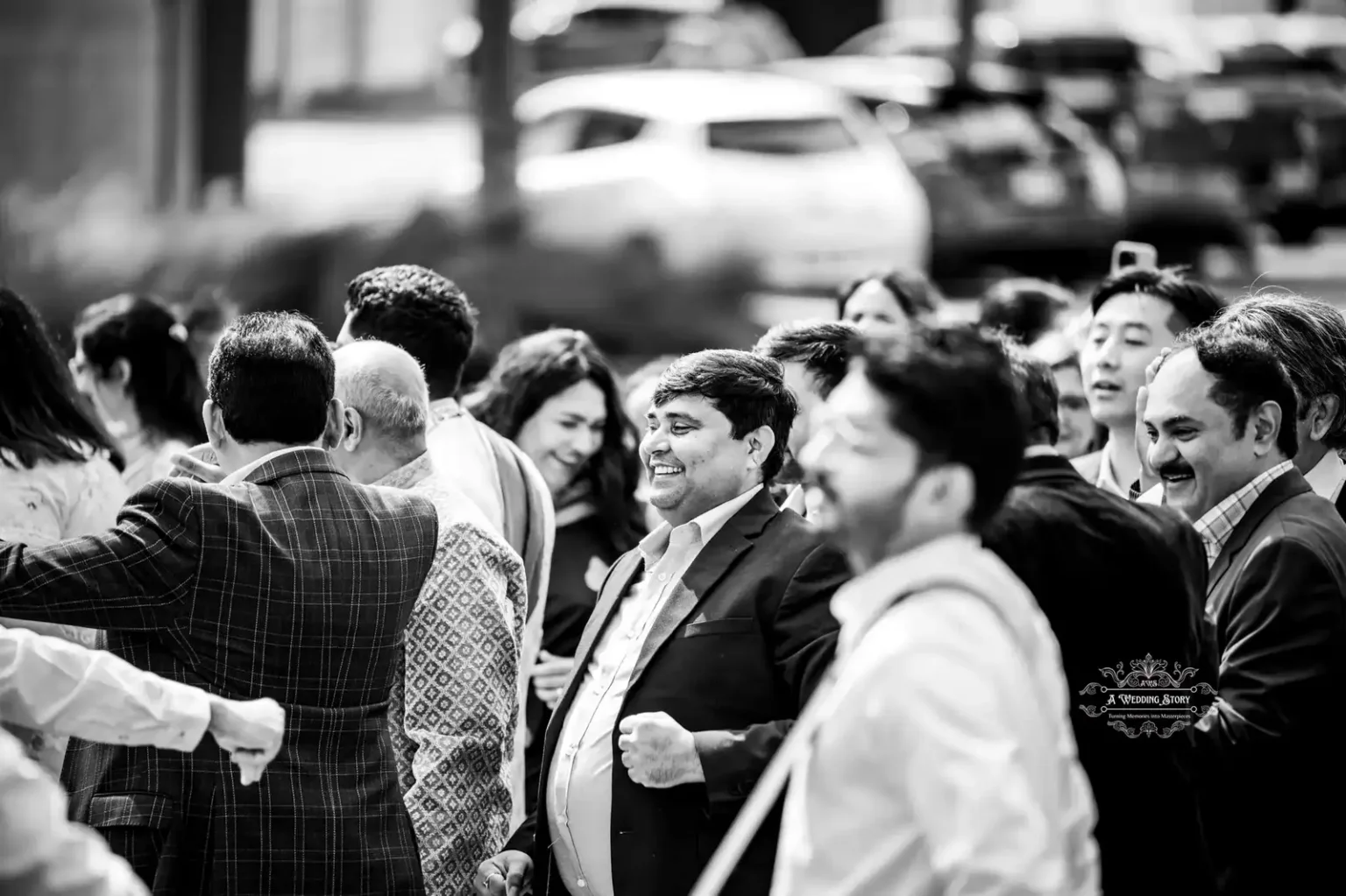 Guests celebrating and smiling during a wedding procession, captured in black and white by Wedding Photography in Wellington