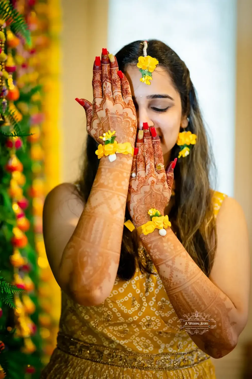 Bride showcasing intricate Mehendi design and floral jewelry during Haldi ceremony, captured by Wedding Photography in Wellington