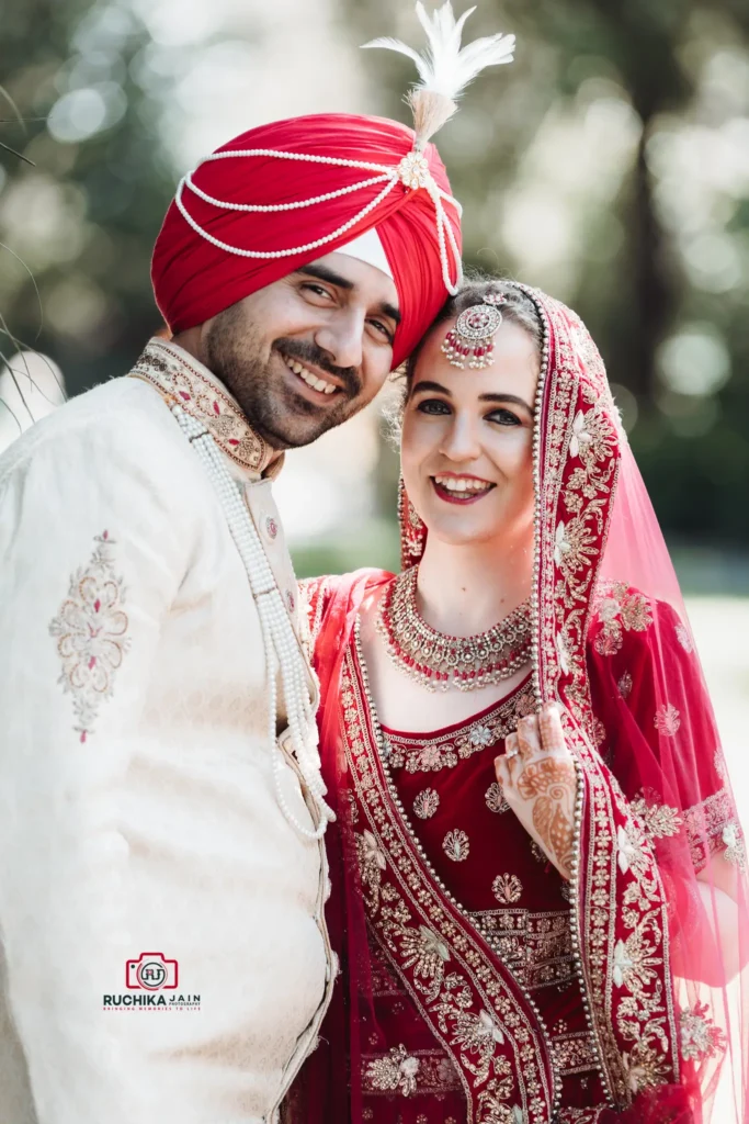 Indian and Western couple posing in traditional wedding attire, captured by Wedding Photography in Wellington, New Zealand