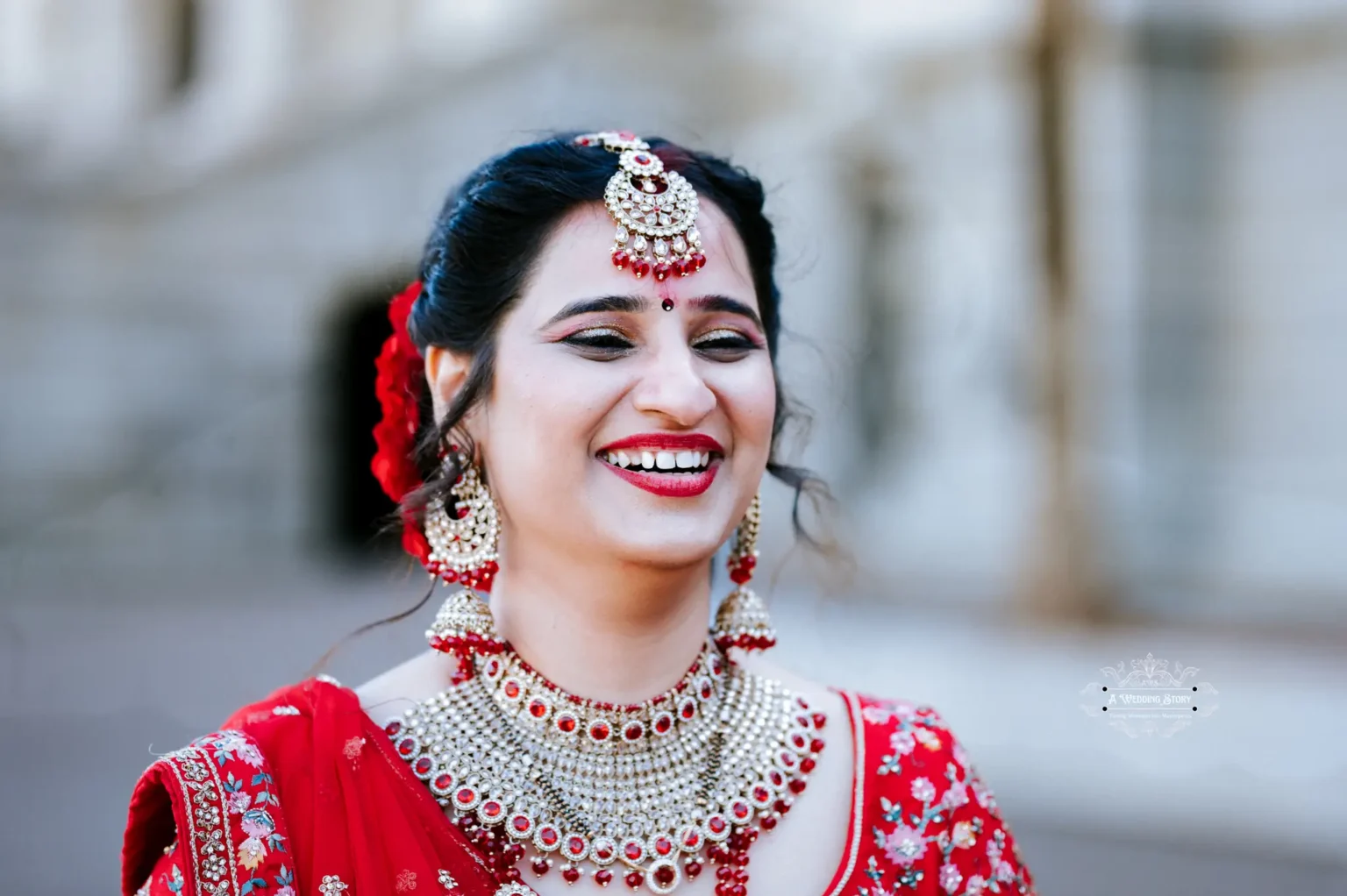 Close-up of a smiling bride in traditional attire during her wedding in Wellington, New Zealand.