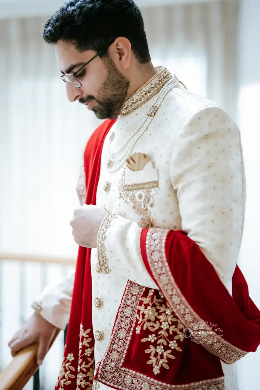 Indian groom in traditional attire, deep in thought before the wedding ceremony, captured in Wellington by Wedding Photography.