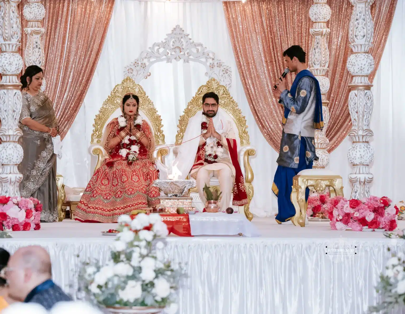 Indian bride and groom participating in a traditional wedding ceremony in Wellington, New Zealand, captured by Wedding Photography.