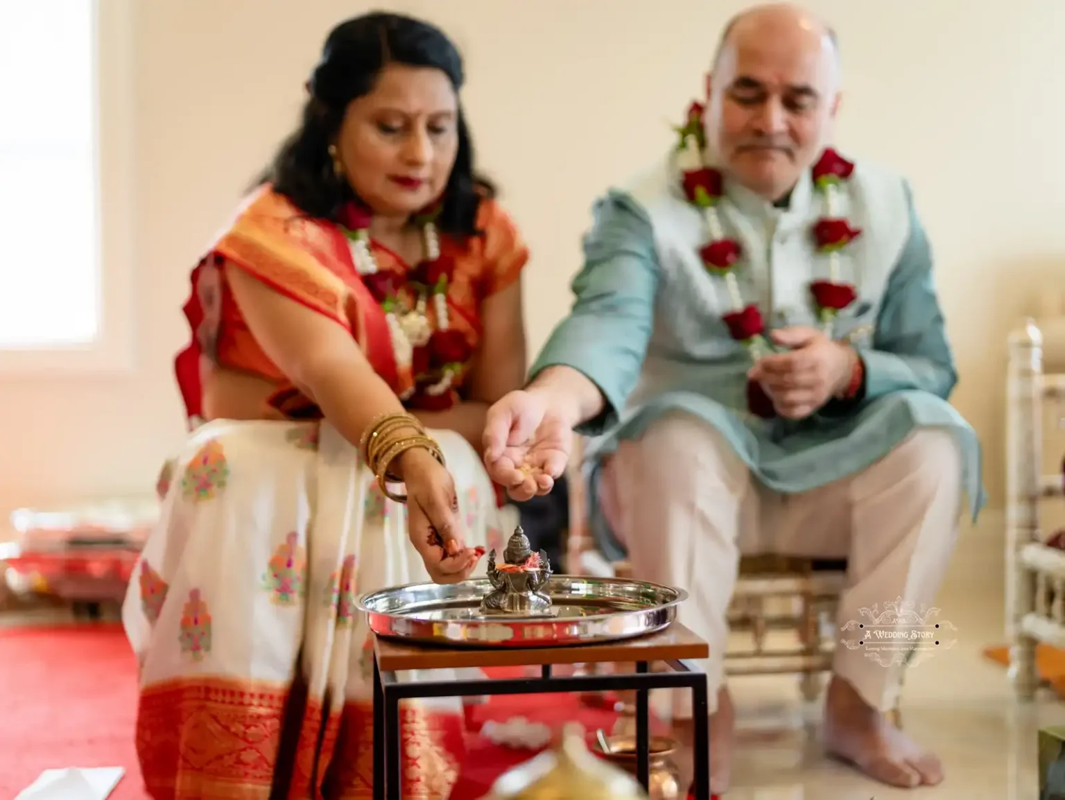 Couple performing traditional wedding ritual with offerings, captured by Wedding Photography in Wellington