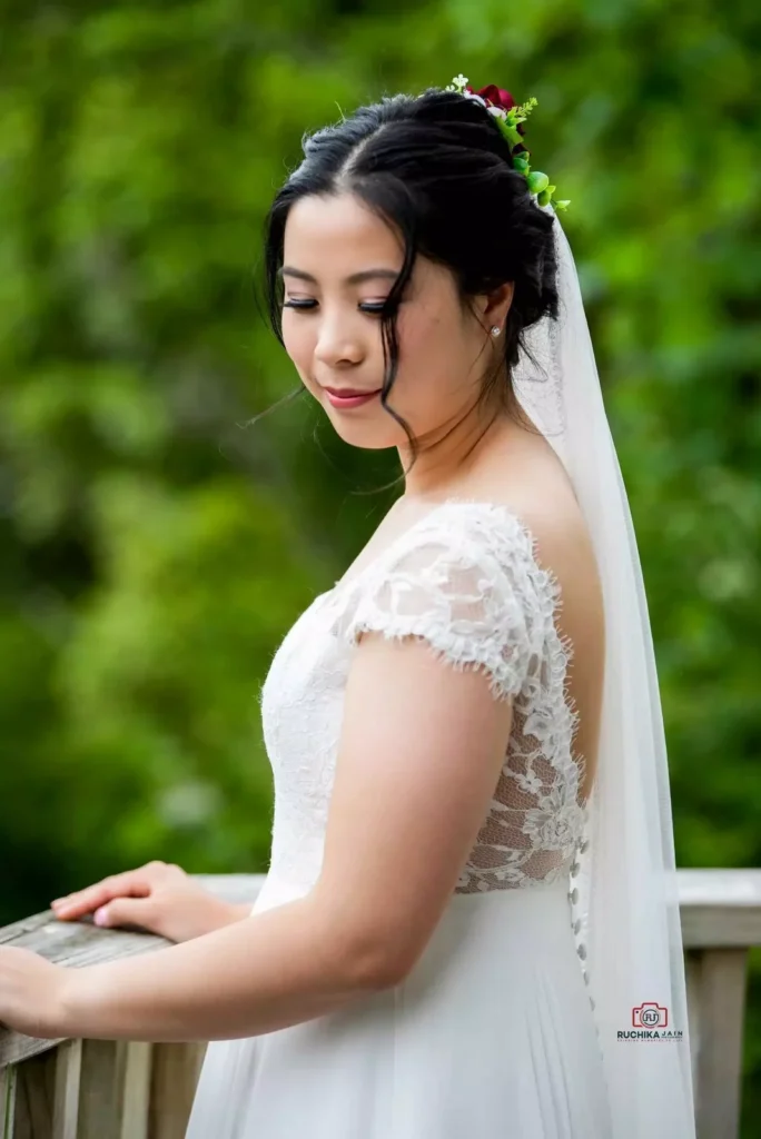 Bride gazing gracefully during an outdoor wedding shoot, captured by an affordable wedding photographer in New Zealand.