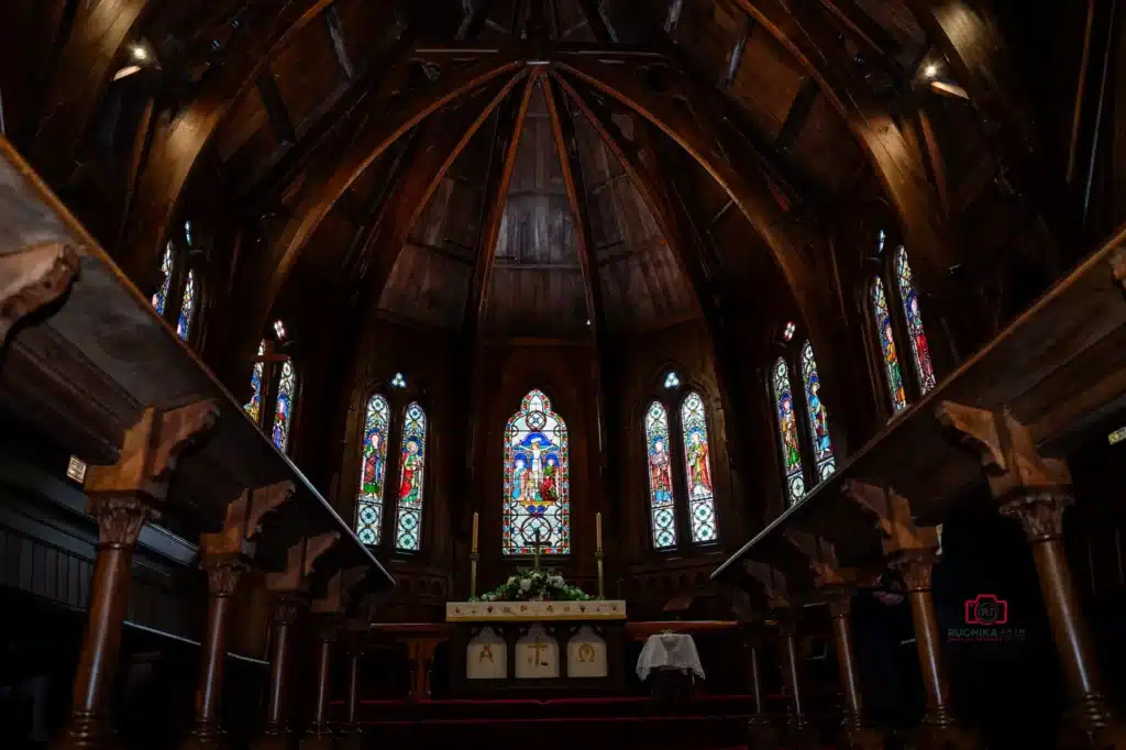 The Gothic Revival architecture interior view of Old St. Paul’s which is an Anglican Church during a beautiful wedding ceremony in Wellington, captured by A Wedding Story