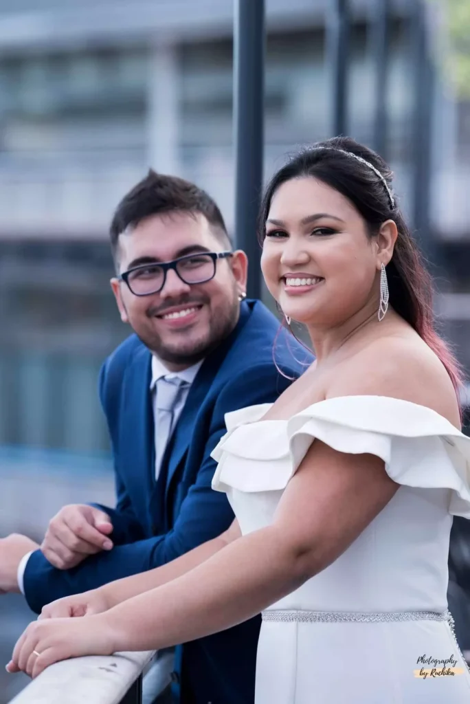 A smiling bride and groom enjoying a candid moment during their wedding in Wellington, New Zealand