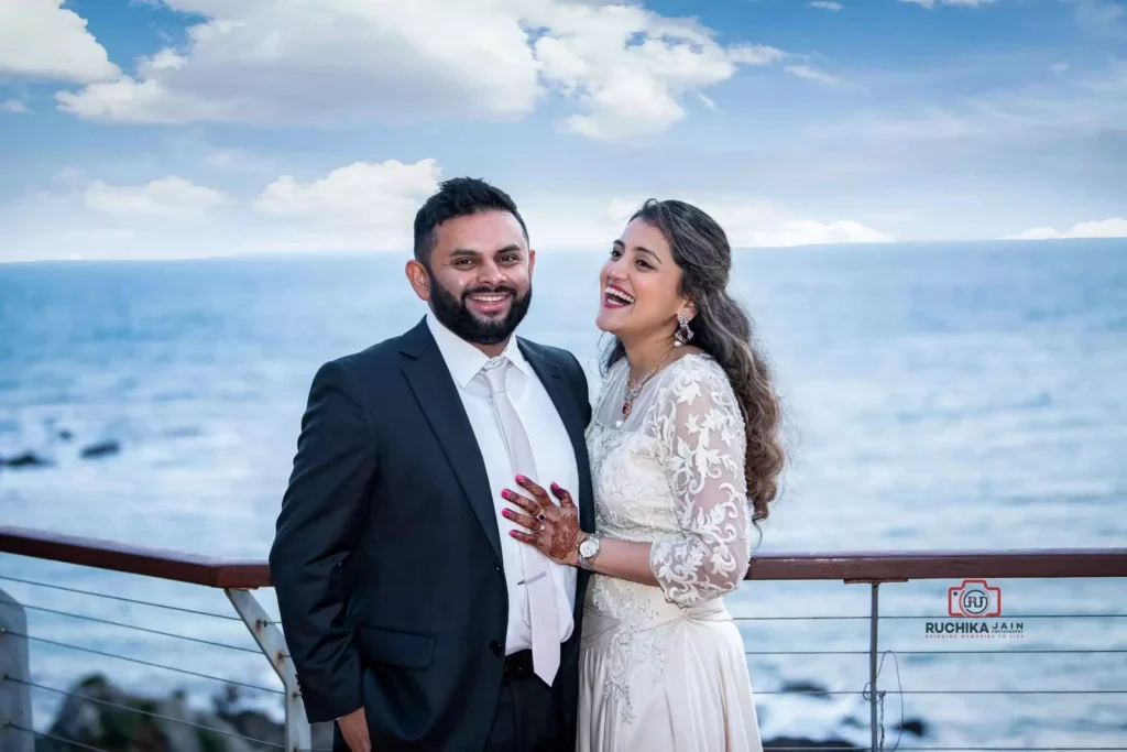 A happy couple shares a joyous moment by the seaside, captured during their wedding day in New Zealand