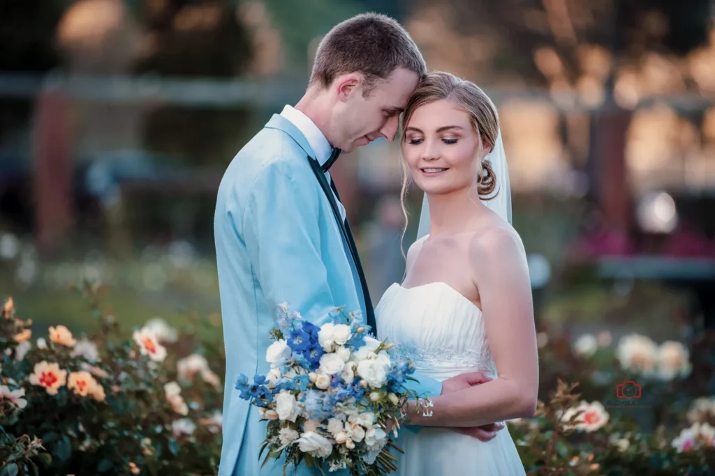 Bride and groom sharing an intimate moment in a beautiful garden, captured by A Wedding Story, professional wedding photographers in Wellington, New Zealand.