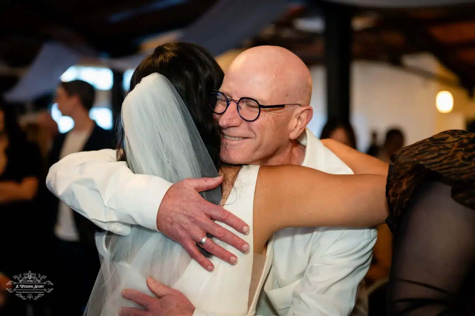 Bride hugging her father warmly during the wedding ceremony in Wellington, New Zealand.