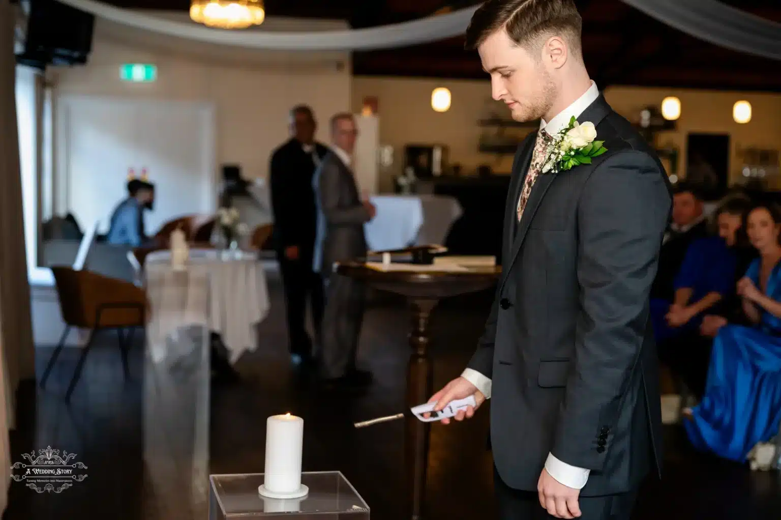 The groom solemnly lights a unity candle as part of a meaningful wedding ceremony in Wellington, New Zealand.