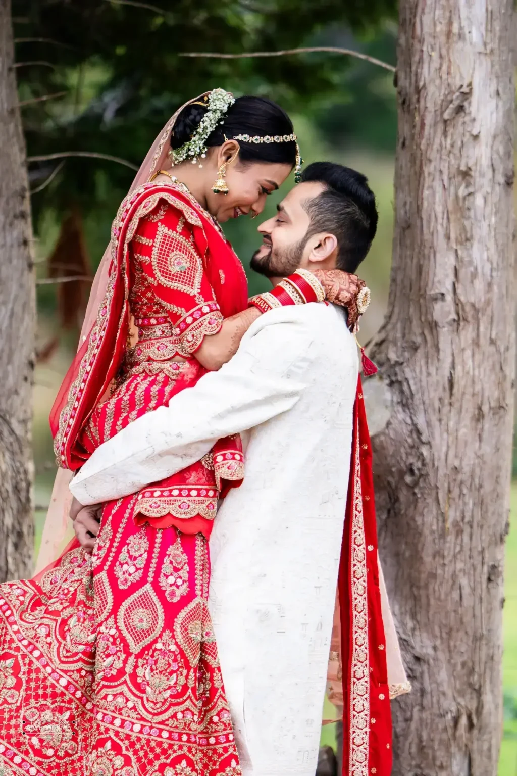 Gujarati groom lifting his bride as they share an intimate moment during their wedding photoshoot in Wellington, New Zealand.