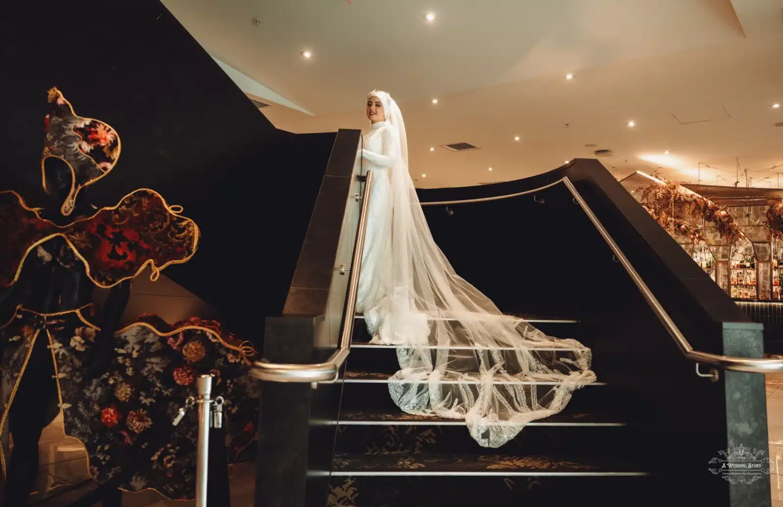 afghan bride stuns in the sofitel wellington hotel staircase before the wedding