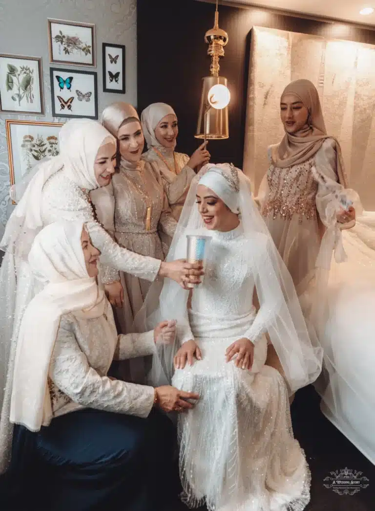 Afghan bride in a white gown, seated and smiling, surrounded by bridesmaids in elegant dresses and hijabs, sharing a joyful pre-wedding moment in Wellington.