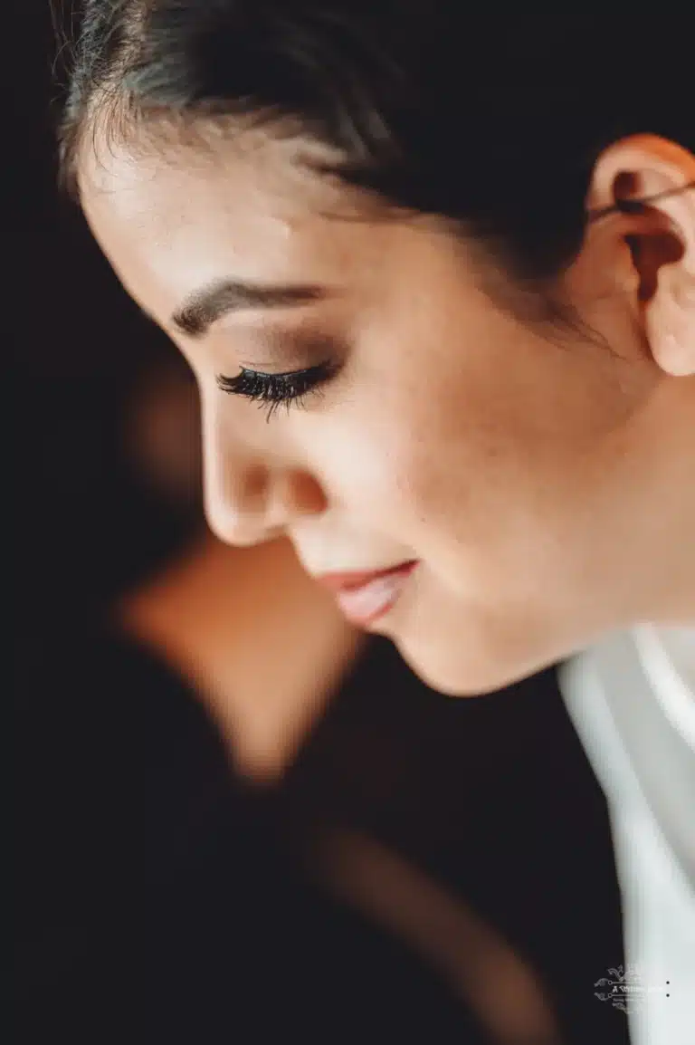 Close-up of an Afghan bride with a serene expression, highlighting her natural beauty and makeup details in Wellington.