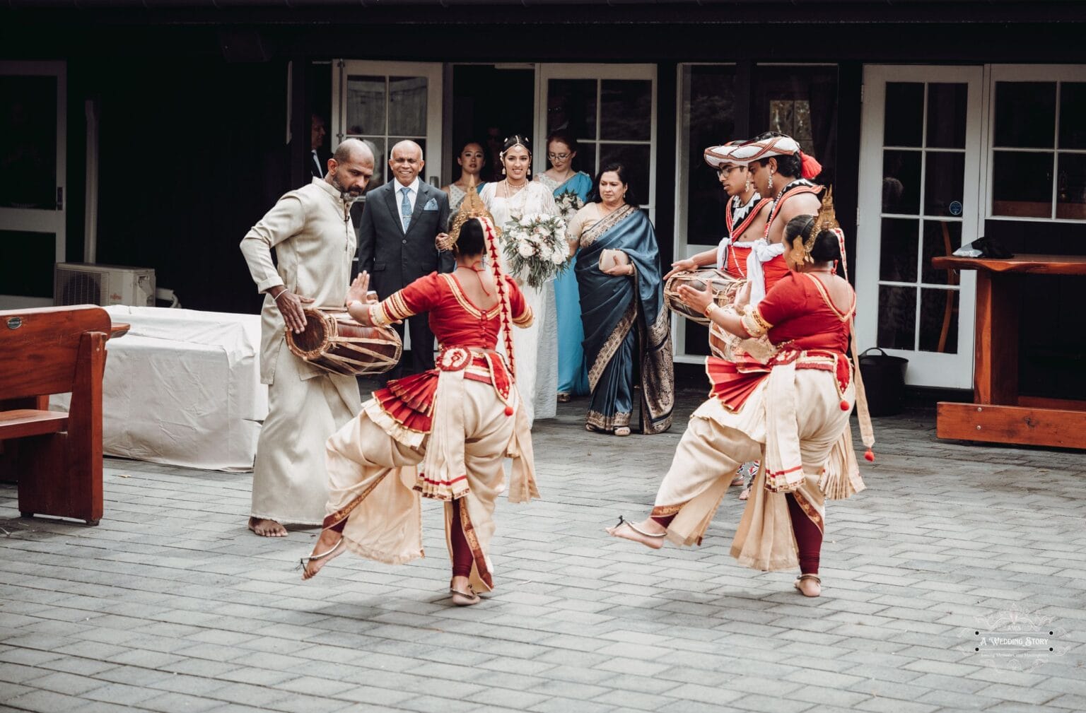 Sri Lankan wedding dancers performing at The Lodge, Wellington, as the bride enters with family and bridesmaids