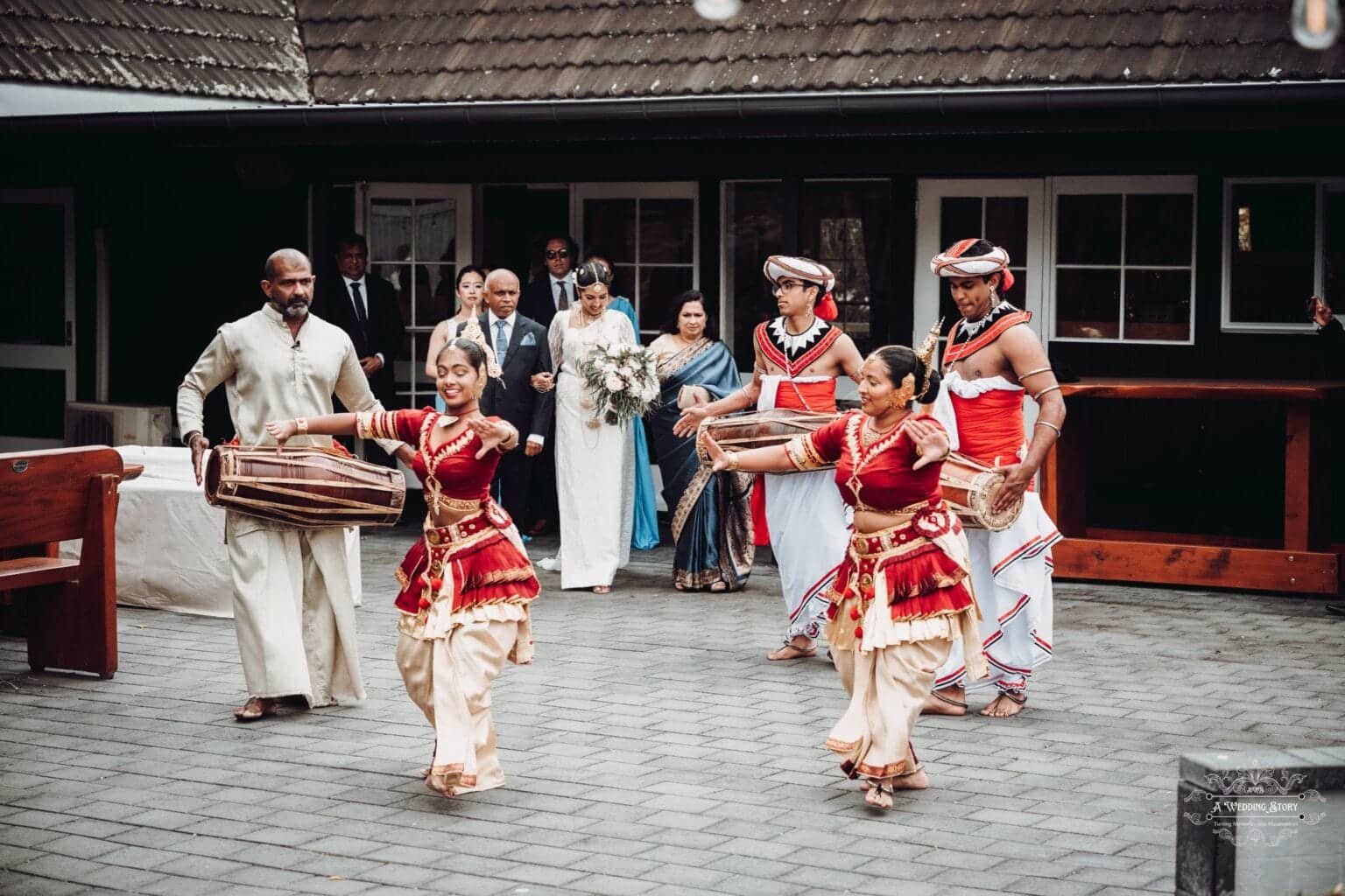 Traditional Sri Lankan wedding dancers performing at The Lodge, Wellington, as the bride makes a grand entrance