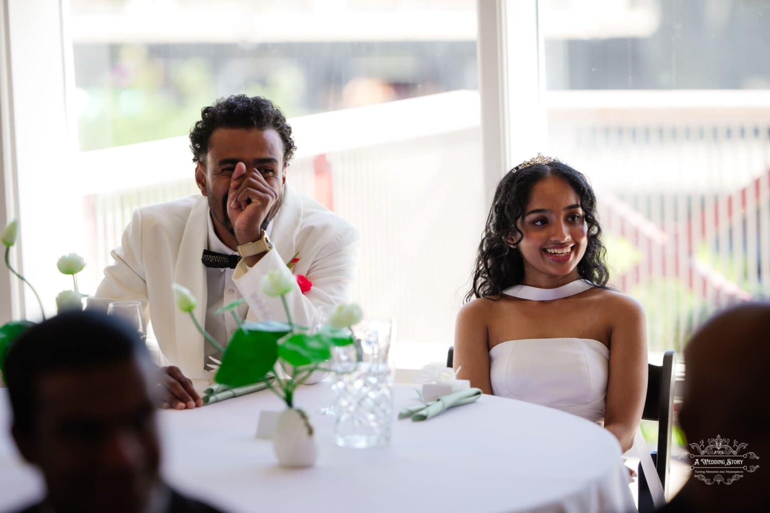 Bride and groom sharing a joyful moment during their wedding reception in Wellington, New Zealand